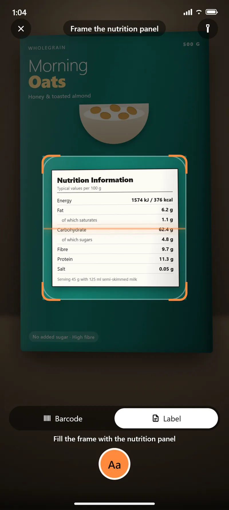 The scanner in Label mode, with the cereal box's nutrition information panel filling the framing bracket. The prompt reads Fill the frame with the nutrition panel, above a capture button.